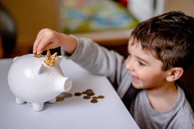 Financial Education for Kids - Preschooler with Piggy Bank