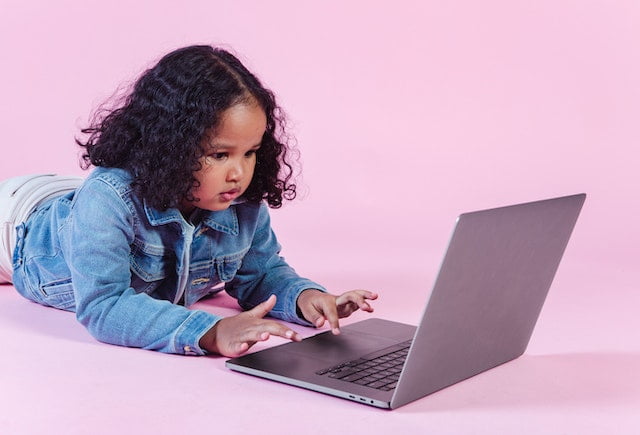 Primary Schooler working on laptop